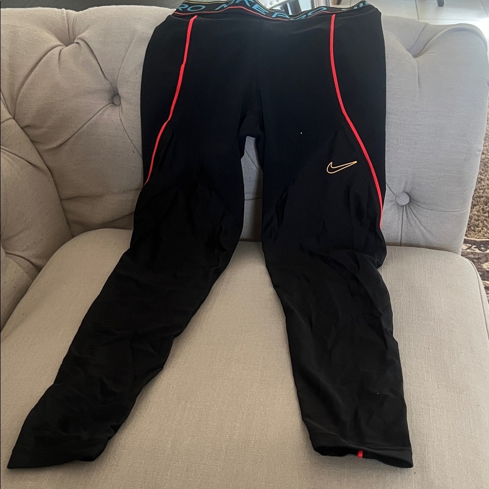 Nike Black Leggings with Red Piping and Gold Swoosh